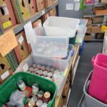 plastic bins of canned food