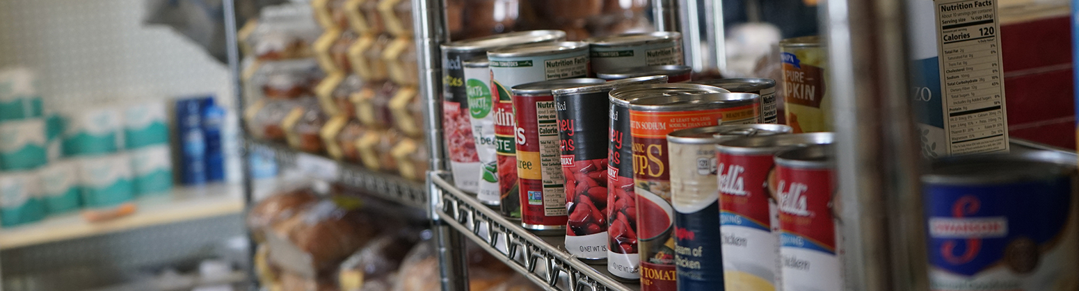 Donate-Header cans and grocery items on shelf