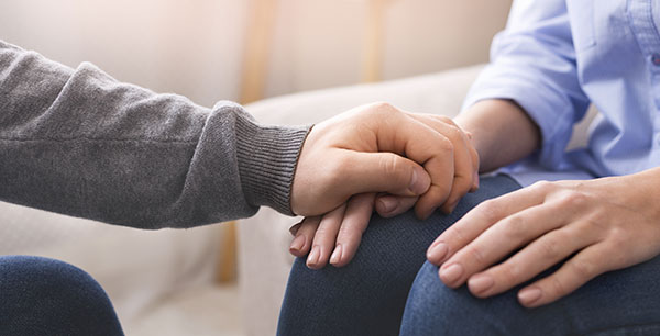 person holding on to someones hand